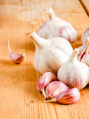 Image showing Raw Garlic On Wooden Background