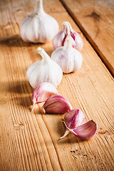 Image showing Raw Garlic On Wooden Background