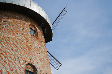 Image showing side of rustic mill with window on sky background 