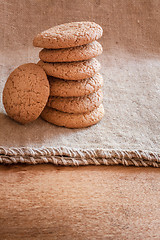 Image showing Stacked Brown Cookies On Rustic Background