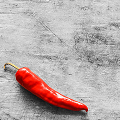 Image showing Red Peppers On Old Wooden Table