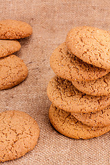 Image showing Stacked Brown Cookies On Rustic Background