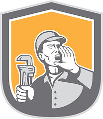 Image showing Plumber Shouting Holding Wrench Shield Retro