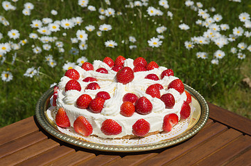 Image showing Homemade cake with cream and strawberries