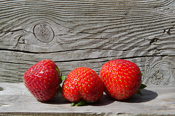 Image showing Strawberries at wooden background