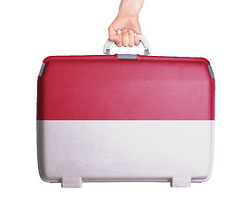 Image showing Used plastic suitcase with stains and scratches