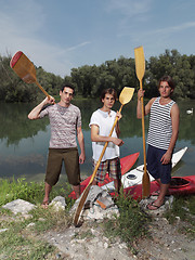 Image showing Young men with kayaks