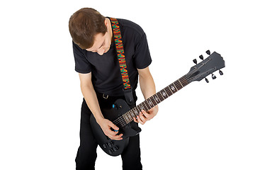 Image showing Young man with electric guitar isolated on white background. Per