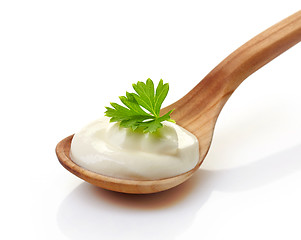 Image showing sour cream in a wooden spoon