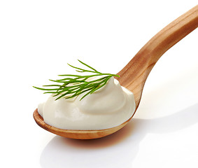 Image showing cream in a wooden spoon