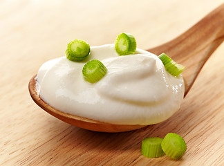 Image showing cream in a wooden spoon