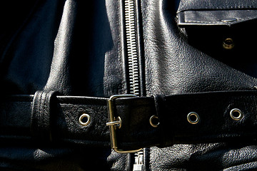 Image showing black leather biker jacket belt zipper and pocket