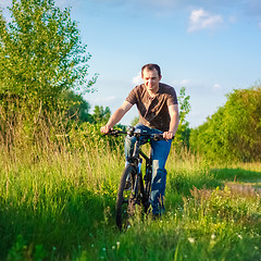 Image showing Young Man On The Bicycle