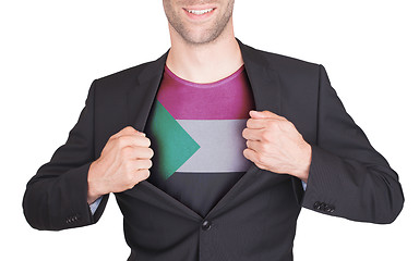 Image showing Businessman opening suit to reveal shirt with flag