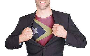 Image showing Businessman opening suit to reveal shirt with flag