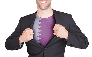 Image showing Businessman opening suit to reveal shirt with flag