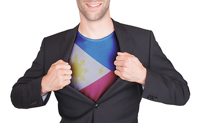 Image showing Businessman opening suit to reveal shirt with flag