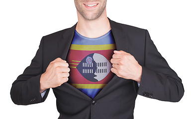 Image showing Businessman opening suit to reveal shirt with flag