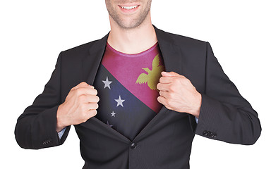 Image showing Businessman opening suit to reveal shirt with flag