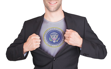 Image showing Businessman opening suit to reveal shirt