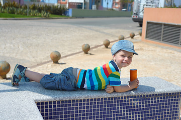 Image showing Cute happy little boy with drink