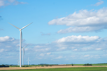 Image showing Wind generator turbine on summer landscape