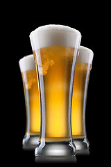 Image showing Beer in glass isolated on black