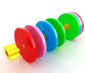 Image showing Colorful dumbbells are assembly and disassembly on a white backg