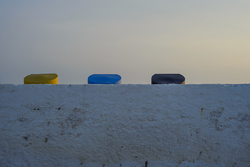 Image showing Colorful containers covers, sunset