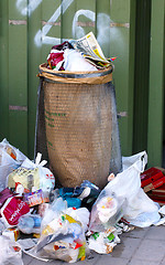 Image showing trashcan with lots of garbage