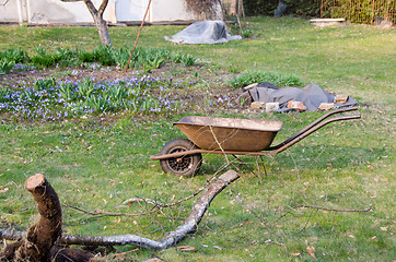 Image showing preparation for spring work, wheelbarrow in yard 