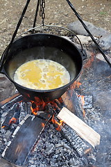 Image showing making food on camp fire