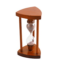 Image showing ancient wooden hourglass over white