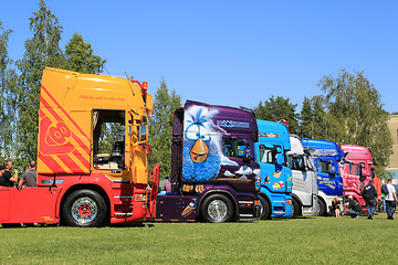 Image showing Row of Colorful Show Trucks