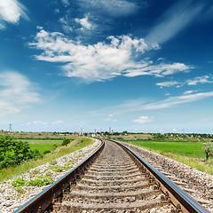 Image showing rail road to horizon under deep blue sky