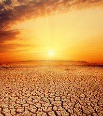 Image showing hot orange sunset over desert