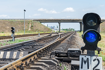 Image showing blue semaphore and railroad crossing