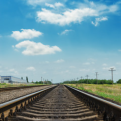 Image showing railroad closeup and clouds in blue sky