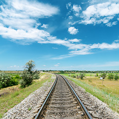 Image showing railway in green landscape and white clouds in blue sky