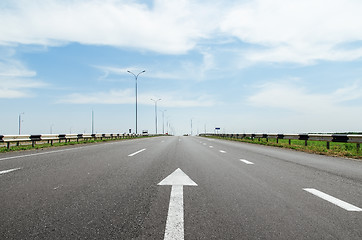 Image showing white arrow on asphalt road