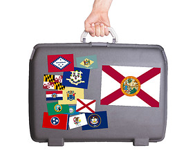 Image showing Used plastic suitcase with stains and scratches