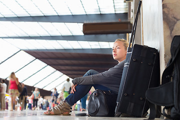 Image showing Female traveler waiting for departure.