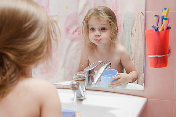 Image showing Three year girl to rinse your mouth after brushing teeth