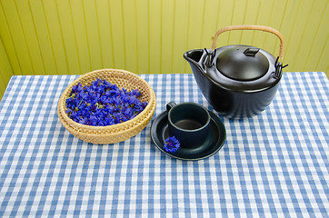 Image showing healing fresh aromatic cornflower tea set on table 