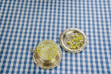 Image showing therapeutic fresh cup chamomile tea small flowers  