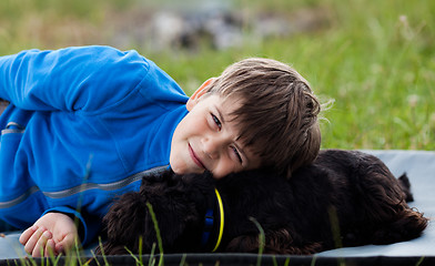 Image showing Young boy with dog