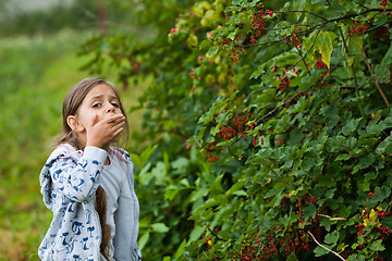 Image showing Little girl in the garden