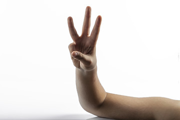 Image showing Young hands making number 3 sign