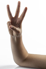 Image showing Young hands making number 3 sign