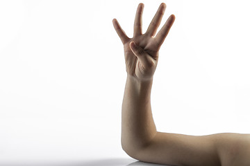 Image showing Young hands making number 4 sign